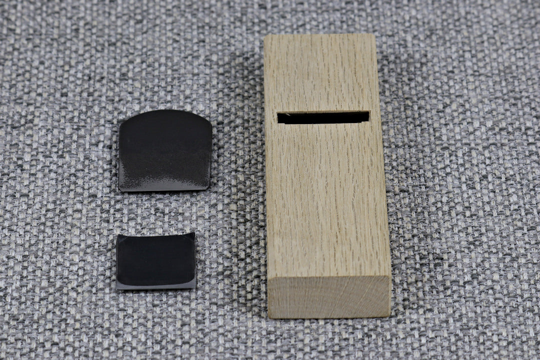 Japanese Kanna - smoothing plane 42mm with blade and cip breaker removed sitting next to plane body