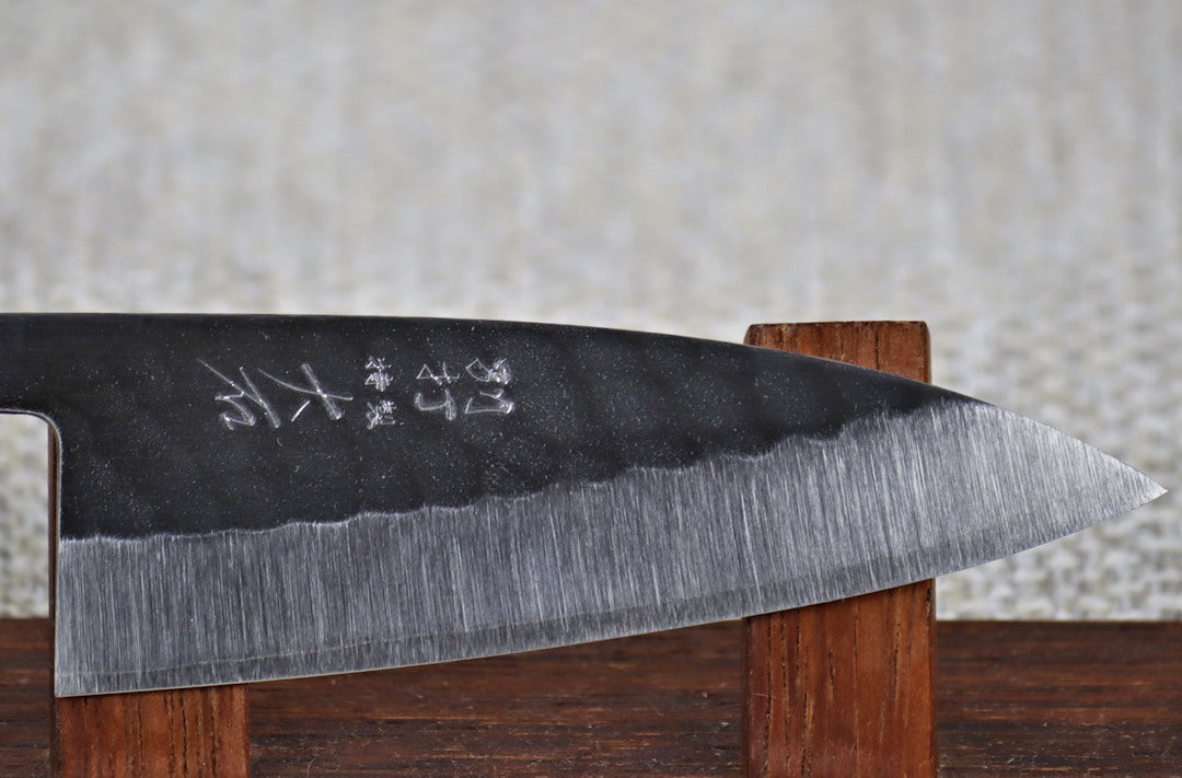 Ohishi SLD Migaki Tsuchime 105mm Ajikiri on red wood stand, close up of blade and finish