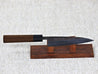 Ohishi Aogami 2 Kurouchi/Tsuchime 135mm Petty (Utility) Kitchen Knife on red wood knife stand